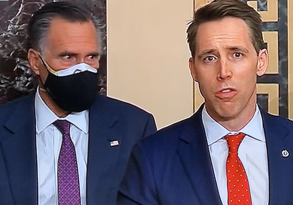 Mitt Romney glares at Josh Hawley from the U.S. Senate floor